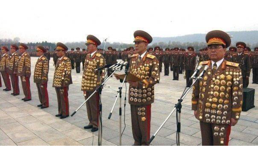 Military officers with numerous medals and badges